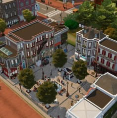 an aerial view of a city with lots of buildings and people walking on the street