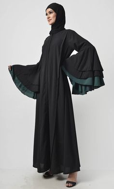 Defined by its dramatic silhouette, this piece sprinkle class add a touch of trend to your black-only wardrobe Round neck Knife pleats on princess seam Multi layer flare sleeves FABRIC: Nida CARE: Machine wash cold Our Model Is Wearing Size 'S' Fitted Long Sleeve Black Abaya, Modest Fitted Black Abaya, Knife Pleats, Flare Sleeves, Abaya Dress, 70 Dress, Everyday Dresses, Princess Seam, Womens Tunics