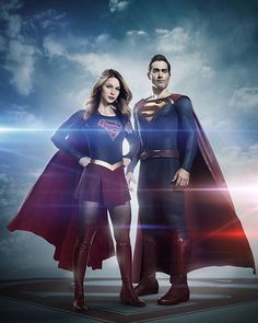 the flash and supergirl are standing in front of a blue sky with white clouds