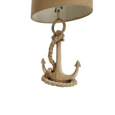 an anchor lamp on a white background with a light shade in the center and rope around it