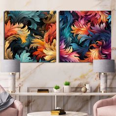 two paintings on the wall in a living room