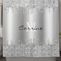 a shower curtain with the name connie written in black ink on it and silver sequins