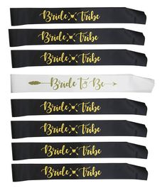 four black and white sashs with gold lettering on the front, one for bride and three for bride to be