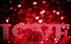 the word love spelled with glitter and roses