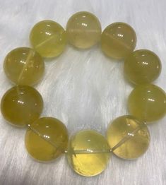 Material:Citrine Quartz beads size :Approx 27mm   quantity: one strand  6mm approx 29 pcs one strands 7mm approx25 pcs one strands 8mm approx 22 pcs one strands 9mm approx 21pcs one strands 10mm approx 19 pcs one strands 11mm approx 18pcs one strands 12mm approx 16 pcs one strands 13mm approx 16 pcs one strands 14mm approx 15 pcs one strands 15mm approx 14pcs one strands 16mm approx 14 pcs one strands 17mm approx 13pcs one strands 18mm approx 13pcs one strands 19mm approx 12pcs one strands 20mm approx 12pcs one strands PLEASE NOTE: 1.Due to lighting effects, monitor's brightness/contrast settings etc, there could be some slight differences in the color tone of the pictures and the actual item. 2.Each piece of natural crystal is unique, the imperfections add natural characters to them. Ther Amber Gemstone Beaded Bracelets With Round Beads, Amber Round Beaded Bracelets With Natural Stones, Amber Beads For Jewelry Making, Yellow Gemstone Beads Crystal Bracelet, Amber Gemstone Beads Bracelets, Amber Gemstone Beads Bracelet, Amber Gemstone Beaded Bracelets, Round Amber Polished Beads Gems And Cabochons, Amber Beads And Cabochons For Gift