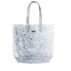 The Packed Party Tote Bag is the perfect blend of style and functionality, designed to complement your on-the-go lifestyle. With its trendy metallic finish, this women's small shoulder bucket bag offers a sleek, modern look that’s versatile enough for work, travel, or beach days. Despite its compact size, it provides ample space for all your essentials, from your phone and wallet to sunglasses and keys. Made from durable materials, this bag is designed to withstand everyday use, while the comfor Rectangular Glitter Bags For Everyday Use, Rectangular Glitter Bag For Everyday Use, Trendy Metallic Travel Bag, Trendy Metallic Shoulder Bag For Shopping, Trendy Metallic Shoulder Bag, Trendy Metallic Bags For Daily Use, Trendy Metallic Rectangular Bag, Trendy Iridescent Party Bag, Metallic Shoulder Bag With Removable Pouch For Party