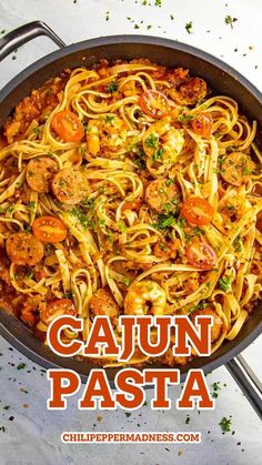 a pan filled with pasta and meats on top of a white countertop next to a