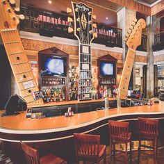 a bar with two guitars on the counter