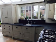 an image of a kitchen setting with black counter tops