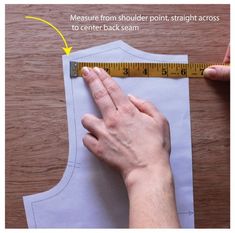 someone is measuring the length of a piece of paper