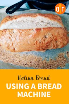 a loaf of bread sitting on top of a table next to a frying pan