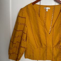 Never Worn. Stretch/Fitted Waist. Button Closure At End Of Sleeves. Color Is Mustard Yellow-Ish. Price Not Firm. Unstitched Yellow Long Sleeve Blouse, Yellow V-neck Blouse With Buttons, Retro Mustard Cotton Top, Cheap Mustard V-neck Blouse, Retro Yellow Button-up Blouse, Puff Sleeve Blouse, Orange Gold, Mustard Yellow, Puff Sleeve