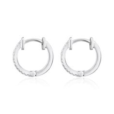 Crafted in 1.29 grams of 14K White Gold, the earrings contains 24 stones of Round Diamonds with a total of 0.09 carat in G-H color and SI clarity. Hypoallergenic Diamond Hoop Earrings In White Gold, Hypoallergenic Small Hoop Diamond Earrings In White Gold, Small Hoop Diamond Earrings In White Gold, White Gold Small Hoop Huggie Earrings With Prong Setting, White Gold Small Hoop Diamond Earrings For Pierced Ears, White Gold Diamond Huggie Earrings Hypoallergenic, Hypoallergenic Diamond Huggie Earrings In White Gold, Minimalist White Gold Hoop Earrings With Diamond Accents, Diamond White Single Huggie Earring