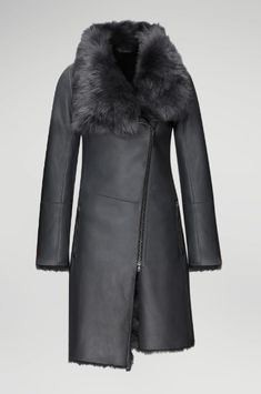 Women's Fur Shearling Leather Coat In Matte Black Experience the luxury of our women's fur shearling leather coat in matte black. Crafted from genuine sheepskin leather with a semi-aniline finish, this coat features a warm faux shearling inner shell. The design includes a zipper closure, a plush fur collar, and open hem cuffs for a sophisticated look. Practicality meets elegance with one inside pocket and two side zip pockets. This matte black coat offers a perfect blend of style and comfort for Leather Shorts Women, Short Leather Skirts, Black Experience, Leather Jumpsuit, Sheepskin Jacket, Shearling Vest, Studded Jacket, Distressed Jacket, Western Jacket