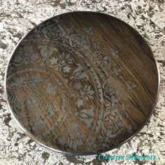 a wooden plate sitting on top of a counter