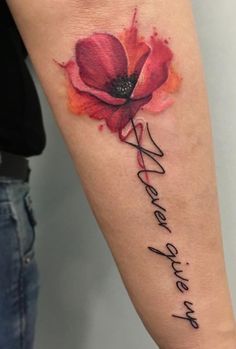 a woman's arm with a red flower on it and the words hope written in cursive writing