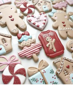 many decorated cookies are laying on the table