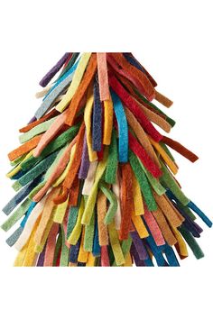 a pile of multicolored sticks on top of each other in the shape of a christmas tree