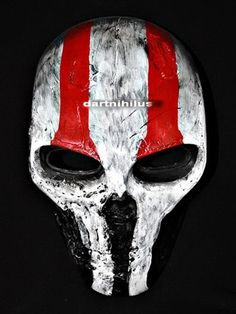 a mask with red and white stripes on it