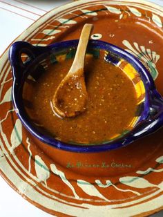 a spoon is in a bowl on a plate