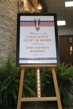 a sign in front of a brick wall that says welcome to the court of honor