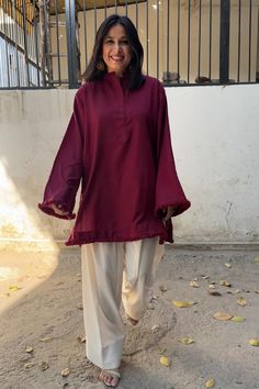 The Dhaaga Set in Dark Maroon is the ultimate winter wear for those seeking comfort with a touch of elegance. Crafted from soft winter spun fabric, this kurta set features a cozy, oversized Pakistani-inspired fit, perfect for chilly days. The ensemble includes our signature Farsi salwar in an equally oversized design, ensuring a relaxed yet stylish look.  Ideal for work, casual outings, or family gatherings, this set offers warmth without compromising on style. Easy to care for, it’s recommended to hand wash or dry clean to maintain its luxurious feel and finish. Embrace winter in effortless sophistication with the Dhaaga Set! Farsi Salwar, Modest Hijabi Outfits, Co Ords Outfits, Pakistani Suit, Desi Wear, Suit Collection, Cute Modest Outfits, Dark Maroon, Soft Winter