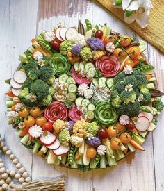 a platter filled with lots of different types of vegetables