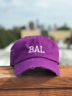 "Purple distressed cotton baseball hat with adjustable Velcro strap perfect for Ravens fans! Embroidered \"BAL\" for Baltimore in white thread." Ravens Fan, Velcro Straps, Baltimore, Trucker Cap, Baseball Cap, Caps Hats, Baseball Hats, Accessories Hats, Super Cute