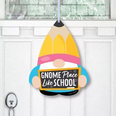 a door hanger that says gnome place like school with a pencil sticking out of it