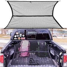 the back end of a pickup truck with luggage in it's bed and an overhead mesh screen