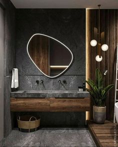 a bathroom with a large mirror above the sink