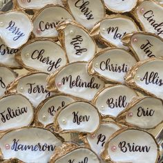 cookies with names on them are sitting in a pile and ready to be decorated for someone's special occasion