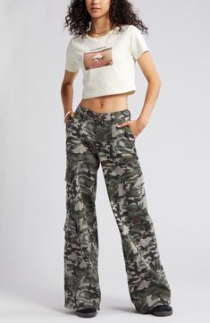 Give in to your style nostalgia and throw it back to Y2K in a pair of wide-leg cargo pants cut from a stretchy cotton blend patterned with classic camo. 32" inseam; 25 1/2" leg opening; 10" front rise; 15" back rise 97% cotton, 3% spandex Machine wash, tumble dry Imported Camouflage Wide Leg Cargo Bottoms, Military Style Wide Leg Cotton Cargo Pants, Camouflage Wide-leg Bottoms With Multiple Pockets, Camouflage Wide Leg Bottoms With Multiple Pockets, Wide Leg Camouflage Bottoms With Multiple Pockets, Camouflage Cotton Bottoms With Cargo Pockets, Utility Wide Leg Camouflage Pants, Camouflage Wide Leg Cargo Pants, Casual Camouflage Cotton Cargo Pants