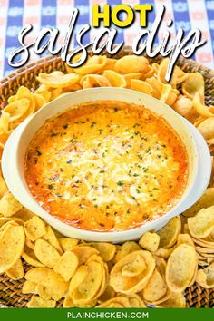 a bowl of salsa dip surrounded by tortilla chips on a plate with the words hot salsa dip