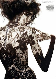 the back of a woman's body is shown in black and white