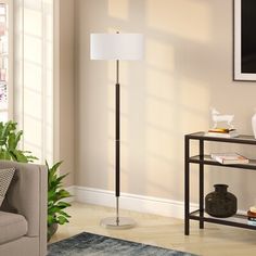 With its streamlined design and glam appeal, this floor lamp offers a versatile look that works with almost any aesthetic. Made from steel, it has a circular base with a slim center support arm with a neutral hue for a luminous touch. It provides the ideal dedicated task or reading light, while a white linen drum shade diffuses light from a single standard bulb of up to 100W (sold separately). This lamp measures 62" tall, so it's just right for placing next to your sofa or armchair. Plus, it's e Contemporary Floor Lamp, Lamp Store, Traditional Lamps, Contemporary Floor, Contemporary Floor Lamps, Metal Floor Lamps, Brass Floor Lamp, Light Bulb Types, Linen Shades