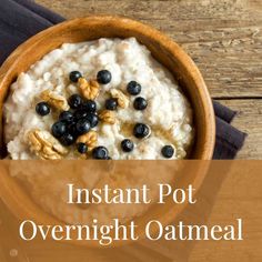 oatmeal with blueberries and walnuts in a wooden bowl on a table