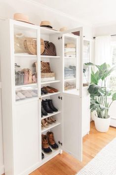 an open closet with shoes and other items in the bottom left hand corner on the right