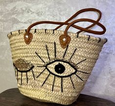 Embark on your sun-soaked adventures with the elegance of our Morocco Basket - your ideal companion for those idyllic beach days and summer outings. This Farmers Market Bag isn't just a statement of style but a trove of practicality for aficionados of the coast and connoisseurs of fashion. Meticulously interwoven from straw, enhanced with fine leather detailing, this Market Basket Bag marries resilience with chic, offering a spacious haven for all your day-out essentials - be it the plush beach towel or the quintessential bottle of sunscreen. Its design echoes the charm of a leisurely stroll by the sea or an amble through vibrant French markets, elevating your presence with its sophisticated, woven allure. Beyond its visual appeal, this Straw Beach Tote stands as a thoughtful token of appr