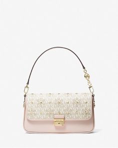 ⚛️100% Authentic Guarantee ⚛️ 👜Michael Kors - Bradshaw Small Embellished Logo and Leather Convertible Shoulder Bag 🍒Color is Vanilla/Soft Pink 🎁Condition is New with Tags 🌷Size: 10.75”W X 5.88”H X 2.75”D 🏆Gold-tone hardware * Push Lock Closure * 7" Handle Drop * 1 Exterior Slip Pocket * Interior details: center slip pocket, center card slot * Dust Bag Included * 1.4 lbs * Leather * Imported 🏆🏆🏆🏆🏆High Quality 👍👍👍👍👍 Beige Bags, Pink Michael Kors Bag, Trip Outfit, Hand Bags For Women, Dream Bags, Mk Purse, Beige Bag, Girl Fits, Michael Kors Handbags