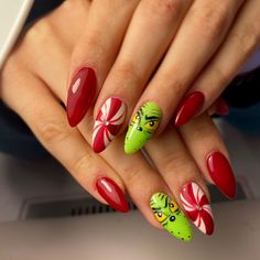 Bring the Grinch to life with 27 Festive Grinch Nail Designs for 2024, featuring easy acrylic, gel, and natural nail art designs that are perfect for Christmas. These short and simple styles are ideal for all skill levels, with step by step tutorials to guide you through the process. Choose from popular nail shapes like almond, square, or round to create fun and festive looks that are perfect for the holidays. Grinch Nail Designs Short, Grinch Nails Almond, Christmas Nails The Grinch, Grinch Face Nails, Grinch Theme Nails, Grinch Nails Short, Grinch Themed Nails, Easy Grinch Nails, Grinch Nails Designs Easy