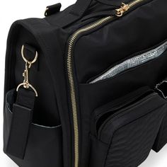 a black backpack with gold zippers and two pockets