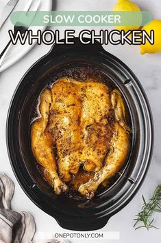 slow cooker whole chicken in a crock pot with lemons on the side