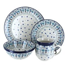 blue and white dinnerware set with flowers on the plate, cup and saucer