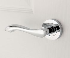 a close up of a door handle on a white door