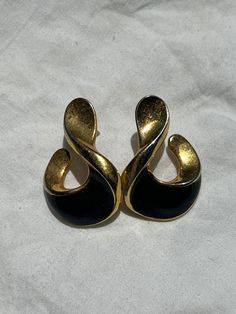 "Vintage, gold black, earrings. Great everyday, classic, stud, post, earrings. For pierced ears.   Medium in size. Made out of metal. In good condition.  Some of the gold has worn off and you can see silver color underneath. **No returns or refunds. Style: mod, glam, goth, minimalist, punk, gothic, grunge, rocker, hipster,  boho, bohemian, hippie, retro, etc...  measurements: 1 1/8\" L x 7/8\"W"