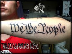 a man with a tattoo on his arm that reads we the people, and has an inscription