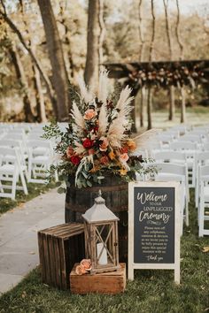 Photo of wedding floral arrangement in fall colors, including pompas grass, red flowers and rust color flowers. Wedding Aisle Outdoor, Fall Wedding Color Schemes, Outdoor Wedding Ideas, Fall Wedding Ceremony, Western Themed Wedding, Wedding Isles, Wedding Aisle Decorations, Wedding Entrance, Wedding 2025