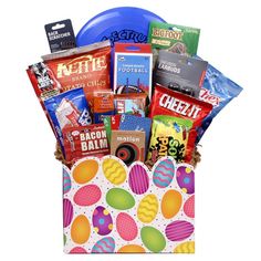 a gift basket filled with candy, candies and other items to be given as a birthday present