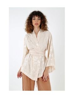 "Our kimono jacket, made of high quality fabric with gold jacquard, has an asymmetrical sleeve cut and a wide belt. Its jacquard fabric makes it extremely elegant. You can attend cocktails in a classic pair of trousers or use it as an elegant dressing gown. It is a special option for brides and bridesmaids. Model body measurements Height: 1.76 cm/ 5'9 Size: S-M/36-38 Bust: 90cm/35,4\" Waist: 60cm/26 \" Hips: 92cm/35,9\" The size of the mannequin : : S/36/6 Size of the product on the mannequin: S-M All of our products are our own special designs. We have different colors and designs that you don't see. We can make many models for you with different fabrics in our store. All you have to do is send us a message. If you want to reach more models, please check out our social media accounts. *Th Elegant Long Sleeve Kimono For Daywear, Elegant Long Sleeve Kimono For Spring, Elegant Cream Kimono With Kimono Sleeves, Spring Evening Long Sleeve Kimono, Elegant Beige Wrap Kimono, Chic Beige Long Sleeve Kimono, Chic Long Sleeve Beige Kimono, Elegant Long-sleeve Kimono For Spring, Elegant Beige Long Sleeve Kimono